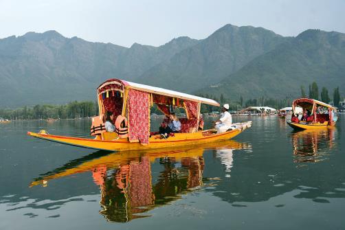 G20 delegates enjoy Shikara ride on the tranquil waters of the Dal lake in Srinagar on Monday.